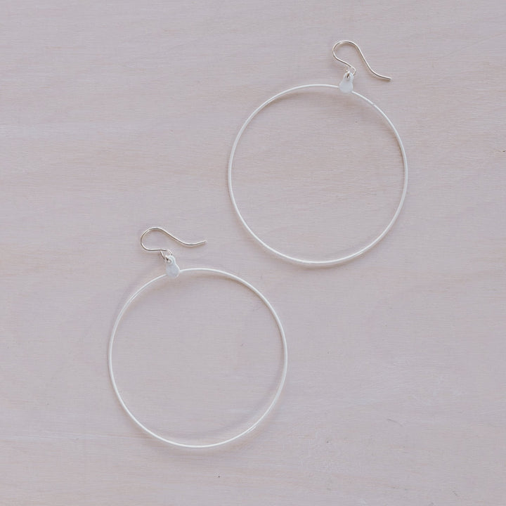 2 white hoop earrings