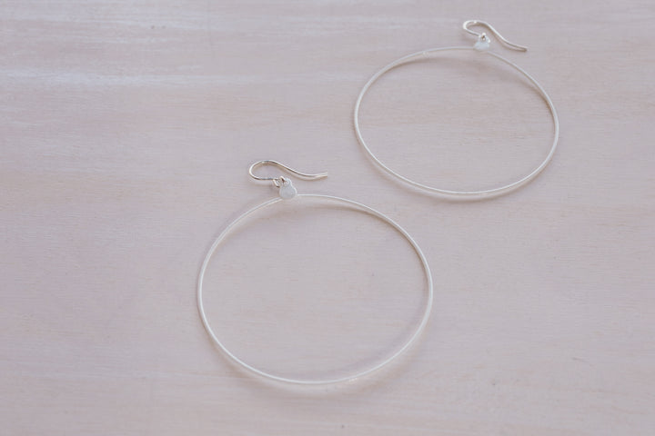 2 white hoop earrings