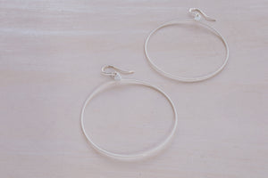 2 white hoop earrings