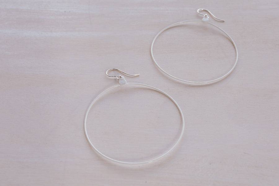 2 white hoop earrings