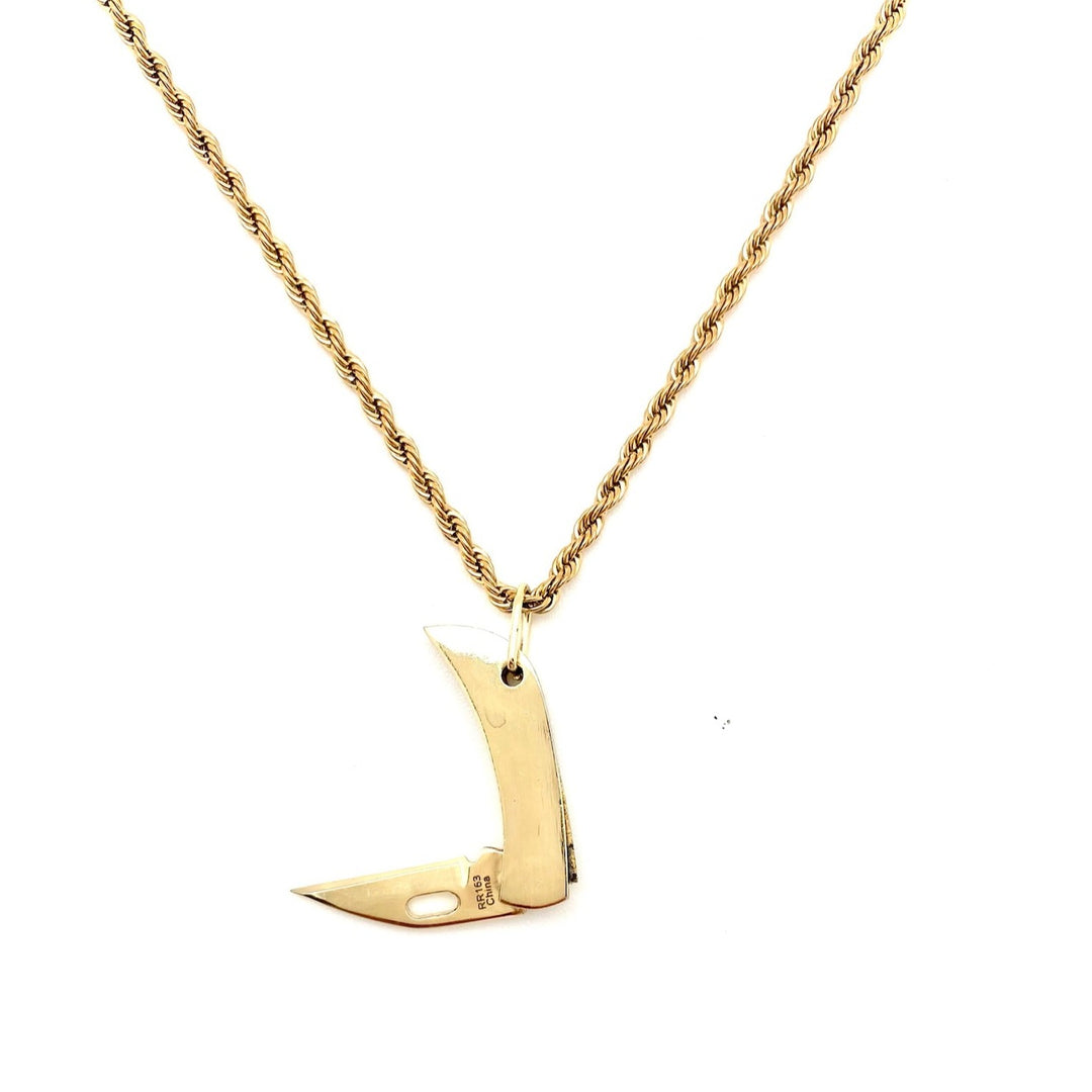 tiny brass pocketknife on a gold chain