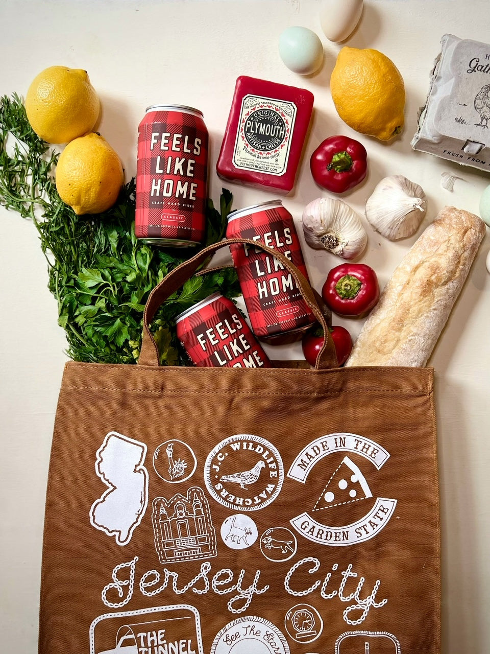 Brown tote bag with groceries spilling out of it
