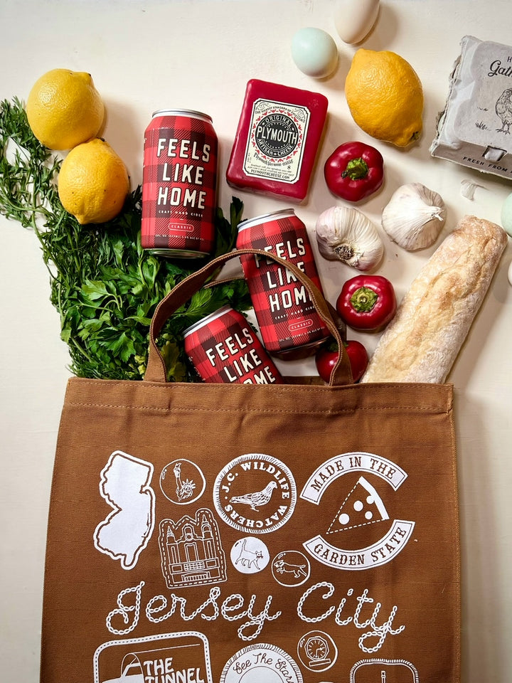 Brown tote bag with groceries spilling out of it