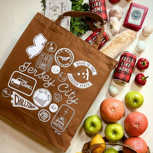 Brown square shaped tote bag with groceries spilling out of it.