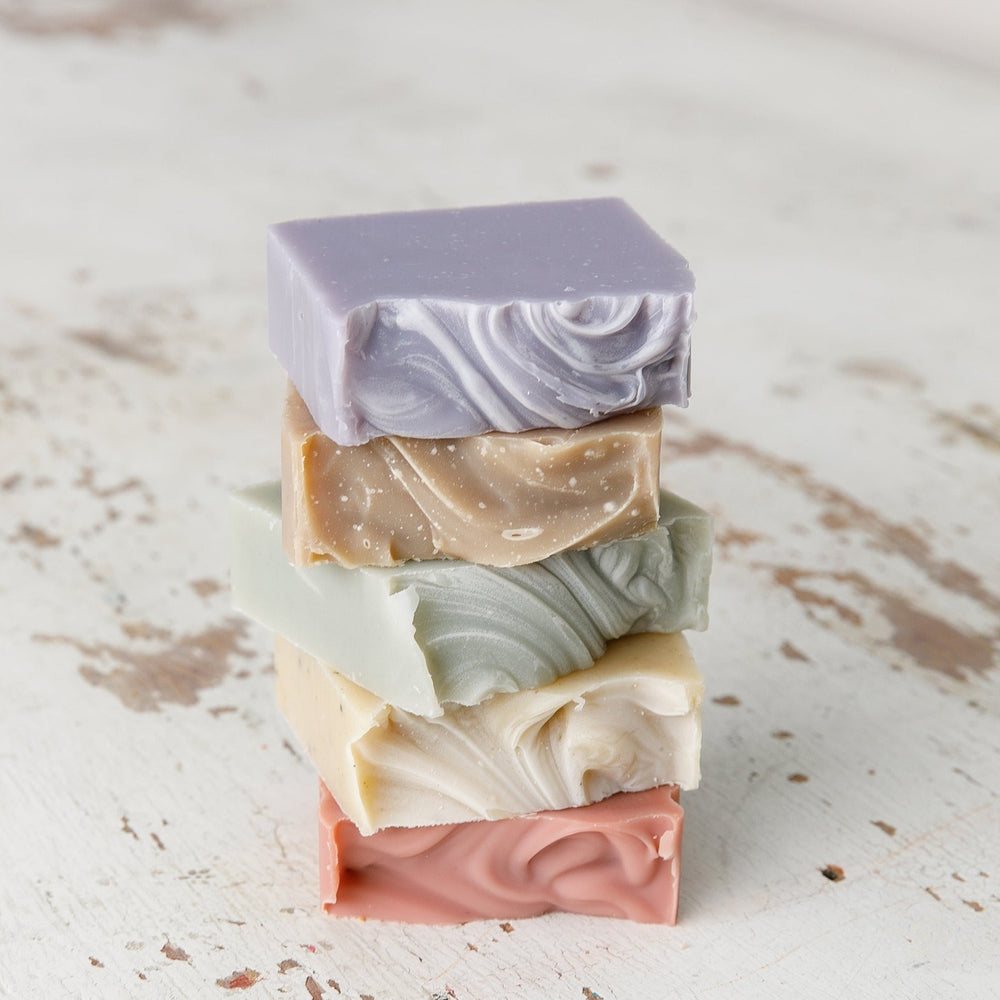 Stack of Old Whaling Co coastal calm bar soap in various pastel colors with textured swirls