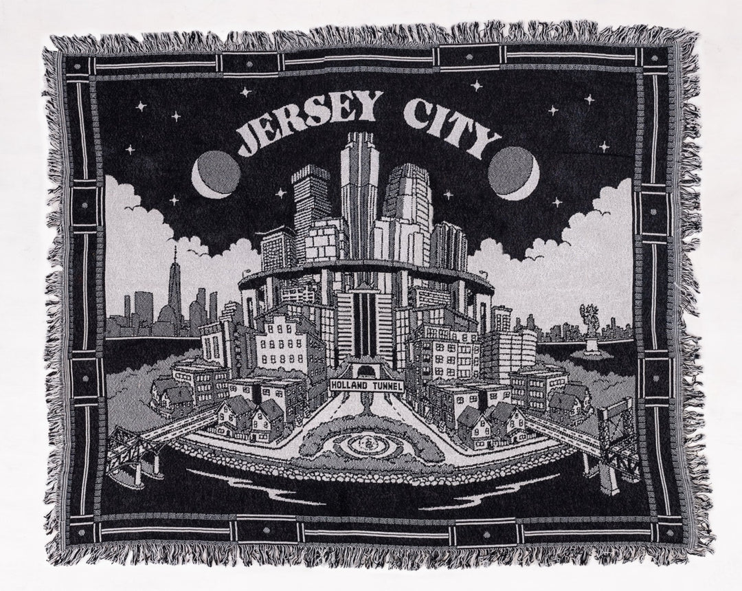 Kanibal & Co. custom Jersey City blanket featuring detailed cityscape design with fringed edges