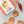 DIY jelly doughnut kit by Farm Steady with doughnuts and piping bag filled with jelly on marble surface