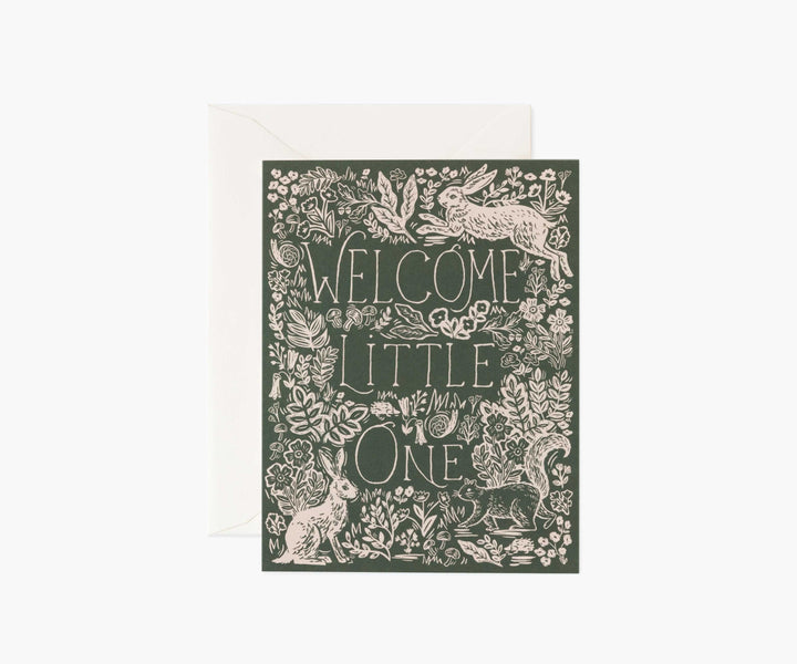 Rectangular card that reads "Welcome little one" on a forest green background with a white floral boarder and rabbits.