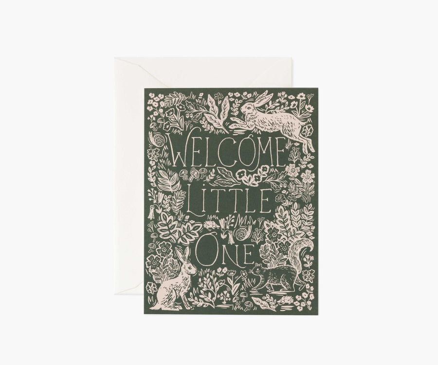 Rectangular card that reads "Welcome little one" on a forest green background with a white floral boarder and rabbits.