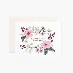 A rectangular card that reads "Wishing you comfort" with a floral design 