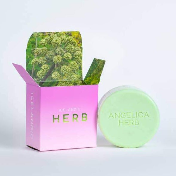 round bar of soap leaning against square packaging