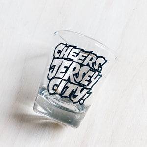 Shot glass that reads cheers, Jersey City!