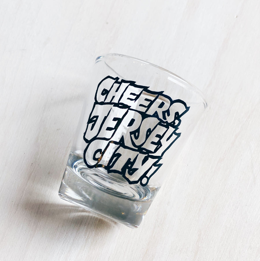Shot glass that reads cheers, Jersey City!