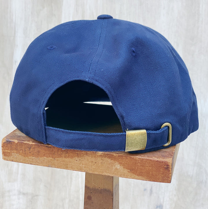 Back view of Weld MFG Jersey City embroidered hat featuring an adjustable strap