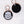 Black circular Jersey City souvenir keychain with white text good things happen in Jersey City
