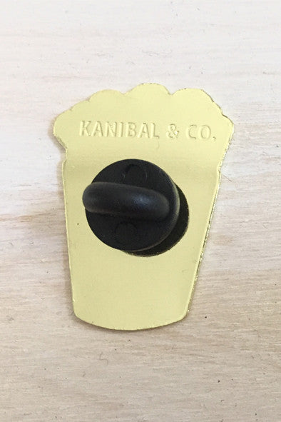 Back view of golden fries enamel pin with black clasp from Kanibal & Co.