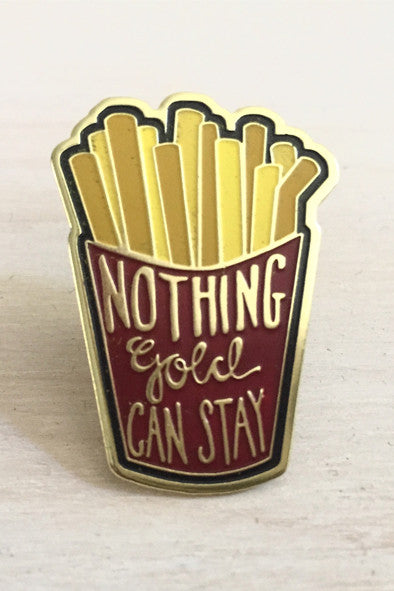 Kanibal & Co. golden fries enamel pin with red container and phrase Nothing Gold Can Stay