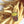 Kanibal & Co golden fries enamel pin with Nothing Gold Can Stay text on a pile of French fries