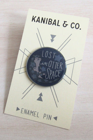 Kanibal & Co otter space enamel pin with Lost in Otter Space design on display card
