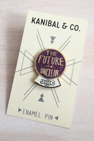Kanibal & Co future is unclear enamel pin with purple and gold crystal ball design on display card