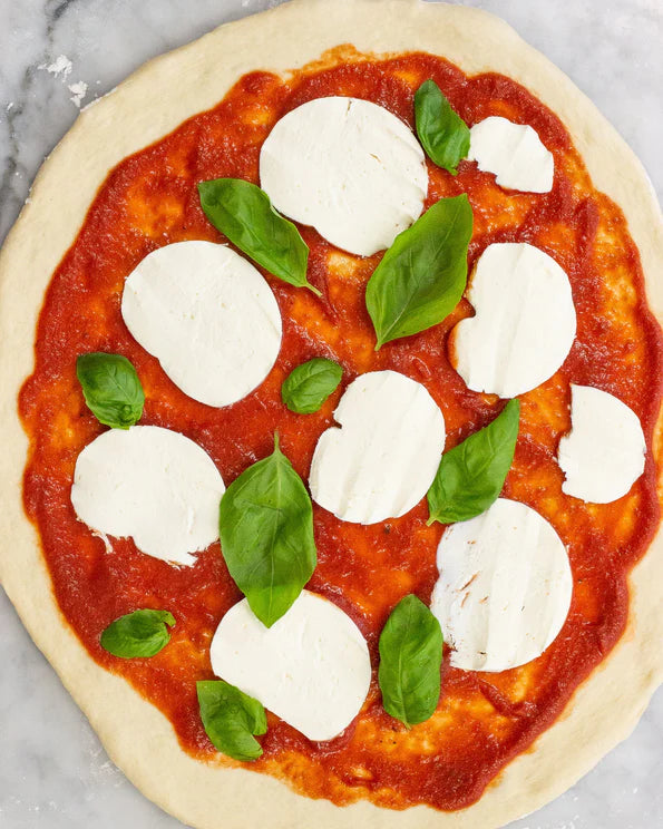 Margherita pizza before it's baked
