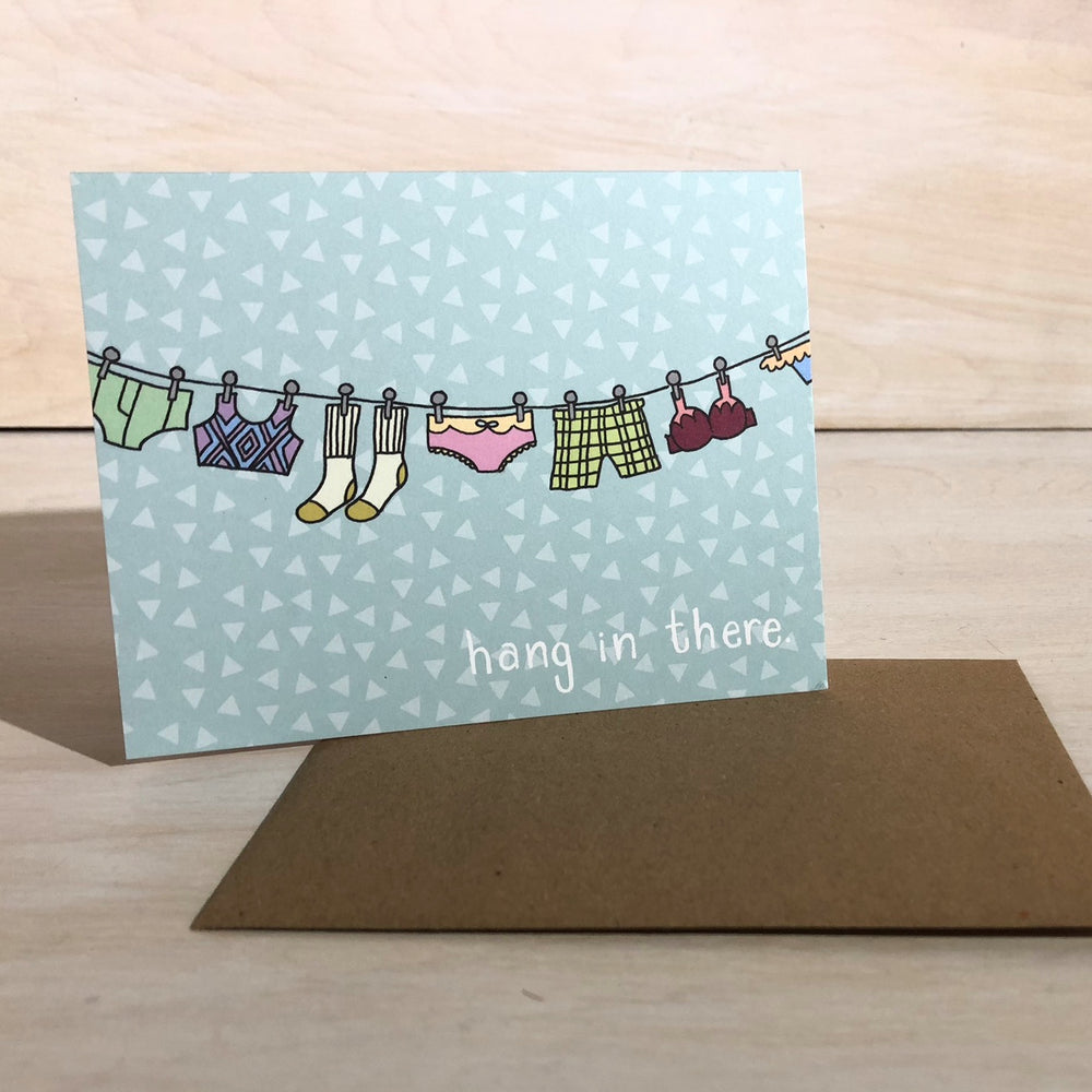 Kanibal & Co encouragement greeting card with hanging clothes and hang in there message