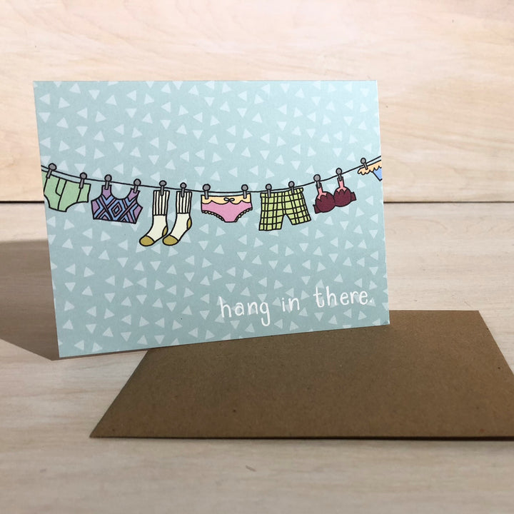 Kanibal & Co encouragement greeting card with hanging clothes and hang in there message