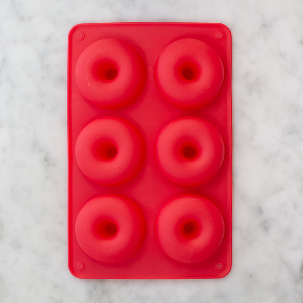Red silicone doughnut pan with six molds for easy non-stick baking by Farm Steady Brooklyn Brew Shop