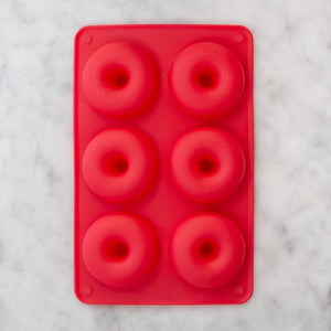 Red silicone doughnut pan with six molds for easy non-stick baking by Farm Steady Brooklyn Brew Shop
